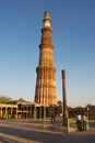 People visit sandstone tower and Iron Pillar at the Qutb Minar complex in Delhi, India.