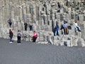 people visit vertical basalt columns at Reynisfjara, the famous black beach in Iceland, near VÃÂ­k ÃÂ­ MÃÂ½rdal, form a perfect