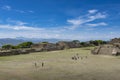 People visiting the ancient ruins of the Monte AlbÃÂ¡n pyramid complex in Oaxaca Royalty Free Stock Photo