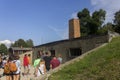 People visiting Auschwitz I camp's gas chamber