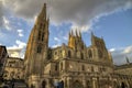 People visiting Catedral de Burgos at sunset