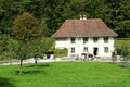 People visiting on horses old farm houses in Ballenberg Royalty Free Stock Photo