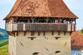 People visiting a lookout tower in the fortified church of Alma Vii village, during a brunch and wine tasting event