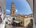 People visiting Monastery of Archangel Michael Panormitis on picturesque island of Symi, Dodecanese, Greece Royalty Free Stock Photo