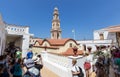 People visiting Monastery of Archangel Michael Panormitis on picturesque island of Symi, Dodecanese, Greece Royalty Free Stock Photo