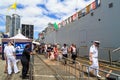 People visiting a New Zealand Navy warship at the Port of Auckland