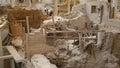 People visiting ongoing ancient Akrotiri settlement excavation site on Santorini