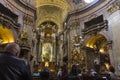 People visiting the st. Peters church in Vienna