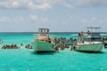 People visiting Stingray city on Gran Cayman in Cayman islands. Stingray city is famous snorkerling spot visited on cruise