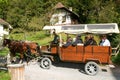 People visiting on tourist buggy old farm houses Royalty Free Stock Photo