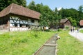 People visiting on walking old farm houses in Ballenberg Royalty Free Stock Photo