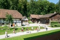 People visiting on walking old farm houses in Ballenberg Royalty Free Stock Photo