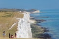 People visiting the white chalk cliffs in the Seven Sisters Country Park