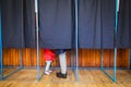 People vote in voting booth Royalty Free Stock Photo
