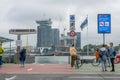 People Wait for the Ferry at the Amsterdam Pier of the Amstel River