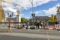 People wait for a green traffic light sign at a pedestrian crossing Royalty Free Stock Photo