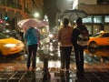 People wait to cross a street in Quito on a rainy night Royalty Free Stock Photo