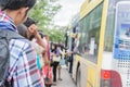 People waiting for on the bus at Mahidol University. graduation