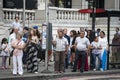 People waiting at a bus stop Royalty Free Stock Photo