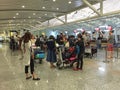 People waiting for check-in at the airport in Bali, Indonesia Royalty Free Stock Photo