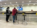 People waiting at the counters at comercial bank