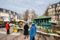 People waiting at florist kiosk shop store