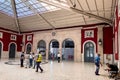 People waiting inside Santa Apolonia railway station in Lisbon Royalty Free Stock Photo