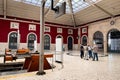 People waiting inside Santa Apolonia railway station in Lisbon Royalty Free Stock Photo