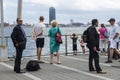 People waiting on a jetty in New York City, USA