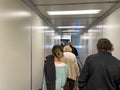 People waiting in the jetway to board an Allegiant airplane at the Sanford International Airport in Sanford, Florida