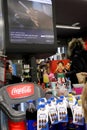 People waiting in line and goods in front of cash register, interior of the Maxi Supermarket Part of Belgian group Delhaize big m