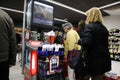 People waiting in line and goods in front of cash register, interior of the Maxi Supermarket Part of Belgian group Delhaize big m