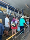 People waiting in line to get on the Monorail in Magic Kingdom