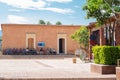 People waiting outside of a building. Teotitlan del Valle, Oaxaca, Mexico