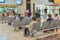 04.08.2023. Barcelona, Spain, people waiting sitting inside the Barcelona Sants train station