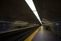 People waiting for a subway in Cote des Neiges station platform, blue line, on Montreal Metro system