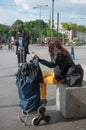 People waiting with suitcase in front of train station in Mulhouse