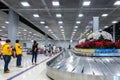 009 - People Waiting Suitcase on luggage conveyor belt at baggage claim at Suvarnabhumi Airport Bangkok. Royalty Free Stock Photo