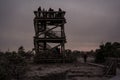 People waiting for the sunrise on watchtower in Kemeri