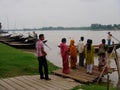 People waiting their turn to board a boat to ferry across