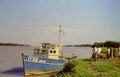 People waiting to board a small river boat near Accra, Ghana, c.1959 Royalty Free Stock Photo