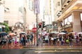 People waiting to cross through busy streets at Hong Kong Times Royalty Free Stock Photo