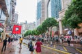 People waiting to cross through busy streets at Hong Kong Times