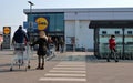 People waiting to enter the supermarket maintain the safety distance provided by the government to block the coronavirus spread