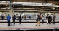 People waiting for the train at flatform in Tokyo, Japan