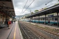 People are waiting for train at platform of train station in Santa Margherita Ligure, Italy