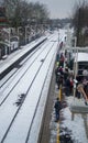 People waiting for the train after an snowfall