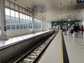 People waiting trains on a platform at train station Royalty Free Stock Photo