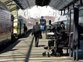 People waiting trains to arrive and leave from the city station Royalty Free Stock Photo