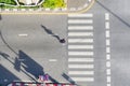 People walk on across business city street Aerial top view Royalty Free Stock Photo